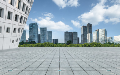 Fototapeta na wymiar Empty city square road and modern business district office buildings in Beijing, China