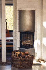 Composition, firewood, stove items, basket. real fireplace filled with firewood.
