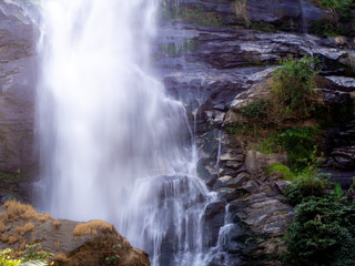 Fototapeta na wymiar Waterfall green forest river stream landscape