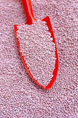 Chemical plant fertilizer with garden trowel for planting and plantation.