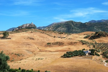 Village with countryside in foreground, Zahara de la Sierra, Spain.