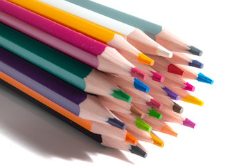 Naklejka premium a stack of multi-colored pencils on a white background.