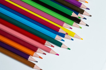 Fototapeta premium multicolored pencils on a white background.