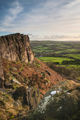 Epic Peak District Winter landscape of view from top of Hen Cloud over countryside and towards Tittesworth Reservoir