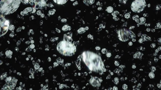 Diamonds rotating and falling towards camera lens against black background in slow motion. 3D Rendered