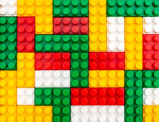 Abstract background of colorful toy blocks. Top view. Children's constructor.