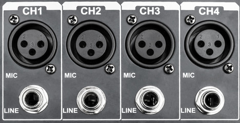 Audio inputs on sound mixer. Close up.