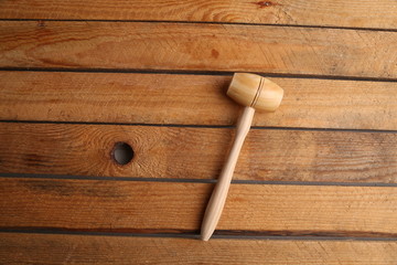 small wooden mallet made of pine wood