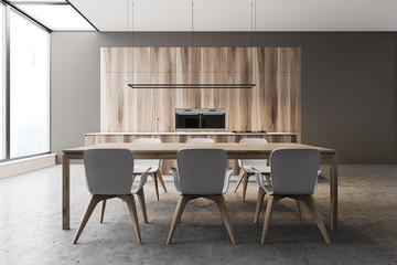 Gray and wooden kitchen, counters and table