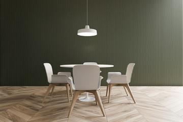 Green minimalistic dining room with round table