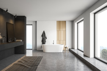 Black and white bathroom, tub and sink, front view