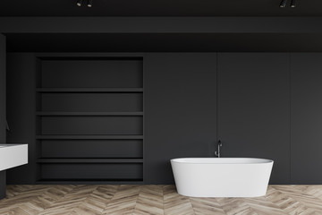 Fototapeta na wymiar Dark gray bathroom with tub and shelves