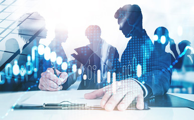 CEO signing document, team and graph