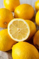 Ripe Yellow Organic Lemons on cloth, side view. Close-up.