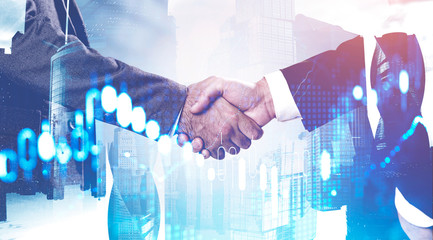 Handshake in city, financial graph