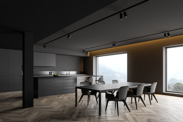 Dark gray kitchen corner with bar and table