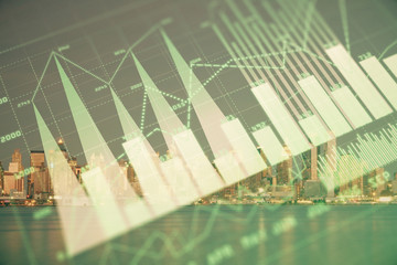 Financial graph on night city scape with tall buildings background double exposure. Analysis concept.