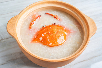 Chinese Chaoshan casserole porridge, a pot of shrimp and crab seafood porridge on the kitchen countertop