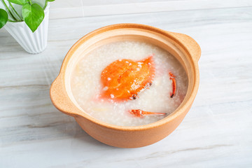 Chinese Chaoshan casserole porridge, a pot of shrimp and crab seafood porridge on the kitchen countertop