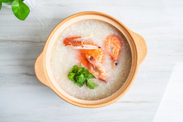 Chinese Chaoshan casserole porridge, a pot of shrimp and crab seafood porridge on the kitchen countertop