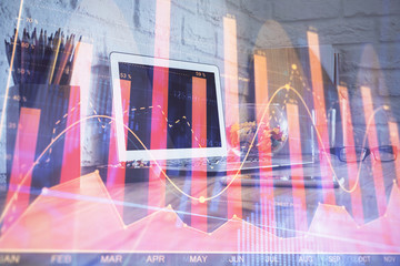 Multi exposure of chart and financial info and work space with computer background. Concept of...