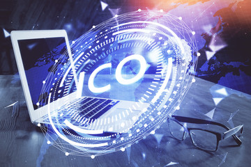 Double exposure of blockchain theme hologram and table with computer background. Concept of bitcoin crypto currency.