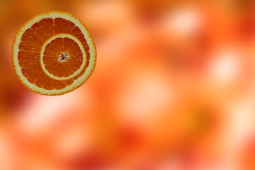 Orange blurred background with orange slices