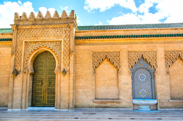Fototapeta na wymiar Moroccan style fountain with fine colorful mosaic tiles at the Mohammed V mausoleum in Rabat Morocco