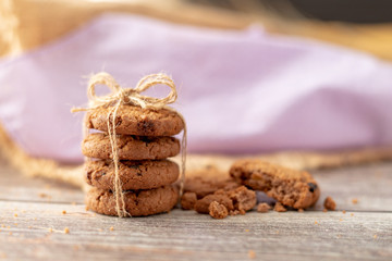 Stacked cookies use a rope tied on a wooden table