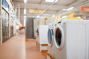 New washing machines in electronics store, nobody