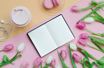 Notepad wish list for future plans. flat lay composition with flowers, a notepad, cup of coffee and sweets