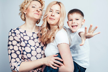 happy smiling blond family together posing cheerful on white background, generation concept. lifestyle people