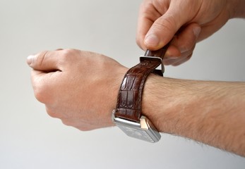 Obraz premium Fastening leather wrist watch strap isolated on white background