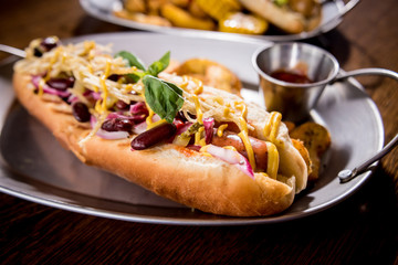 Hotdogs and French fries on a dishes. Fast food meal. Restaurant.