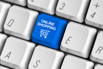 Blue "online shopping" button on the white computer keyboard.