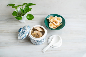 Chinese health tonic soup, stewed chicken soup with ring snails