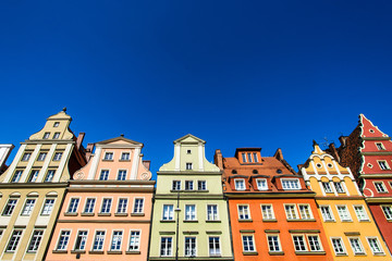 Fototapeta premium Colourful houses, blue sky, Solny square, Wroclaw, Poland. Copy space