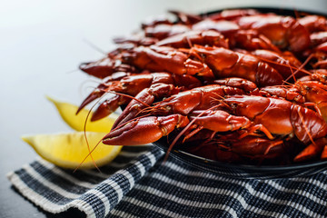 red crawfish with lemon on dark wood table