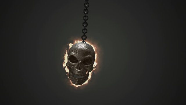 Burning skull rocks back and forth on the chain. Animation of swinging skull on chain.
