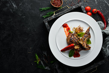 Grill a steak on the bone with chili. Dishes, food. Top view. Free space for your text.