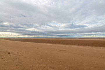 Fototapeta na wymiar The vast sandy beach at Formby in Merseyside, at low tide