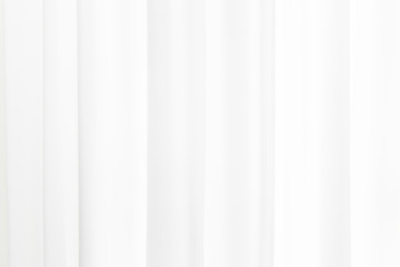 Obraz premium White soft fabric rippled curtain texture abstract background