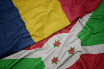 waving colorful flag of burundi and national flag of chad.