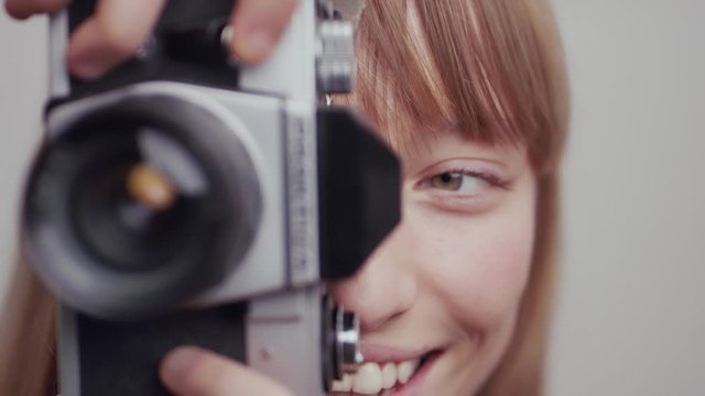 beautiful woman smiling while she holds the camera and takes a picture