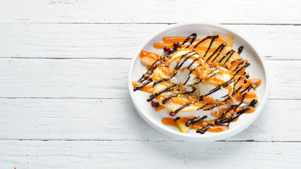 Dessert. Caramel and chocolate ice cream. Top view. Free copy space.