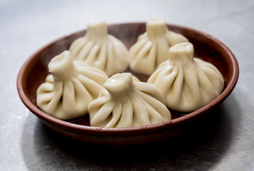 Georgian khinkali with meat. National cuisine, cooking process. 