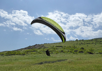 Paraglider landing at Brestovitsa in Bulgaria