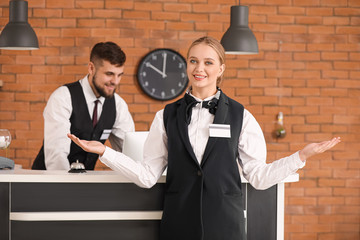 Male and female receptionists in hotel