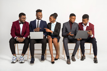 handsome african people in suits on white background with laptops