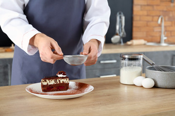 Male chef cooking in kitchen, closeup